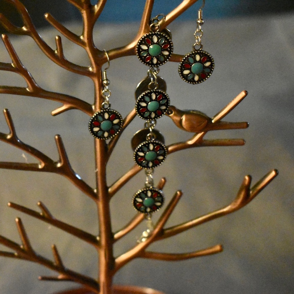 Handmade metal bracelet and earrings.